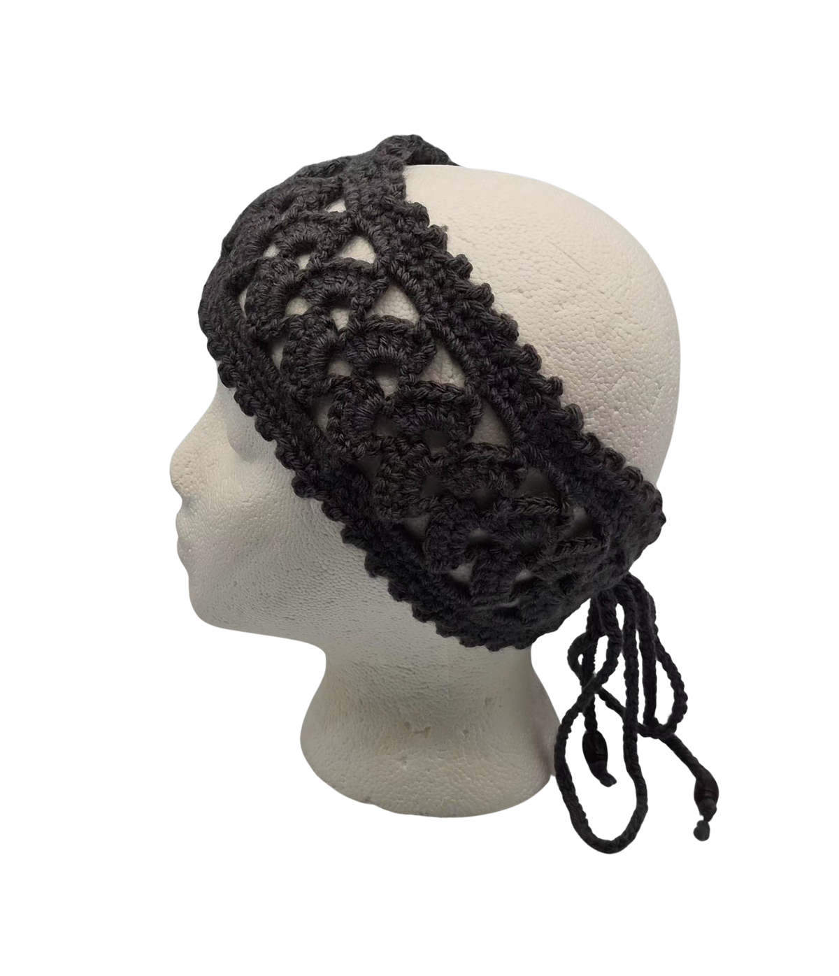 A dark charcoal crocheted headband with a lace pattern and drawstring ties, displayed on a white mannequin head.