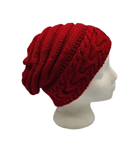 A deep red cable-knit slouchy beanie hat displayed on a white mannequin head.