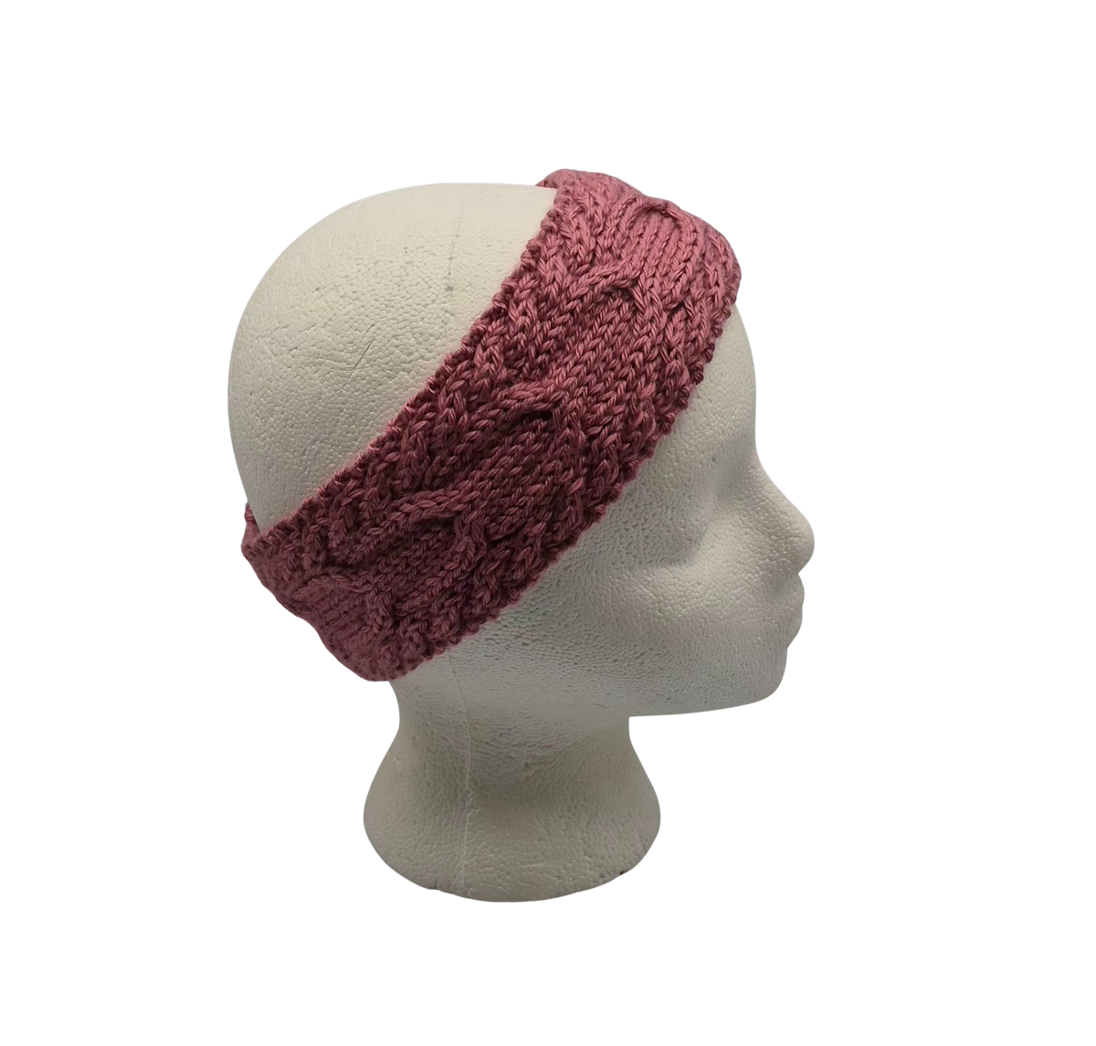 A dusty rose  cable-knit headband displayed on a white mannequin head.