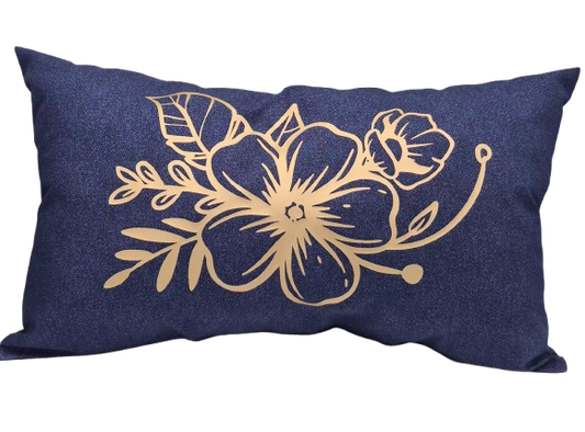 A rectangular navy blue throw pillow featuring a gold floral vinyl design on the front.