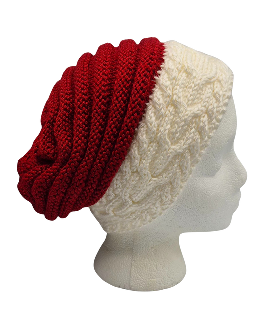 A red and white cable ribbed-knit slouchy beanie hat displayed on a white mannequin head.