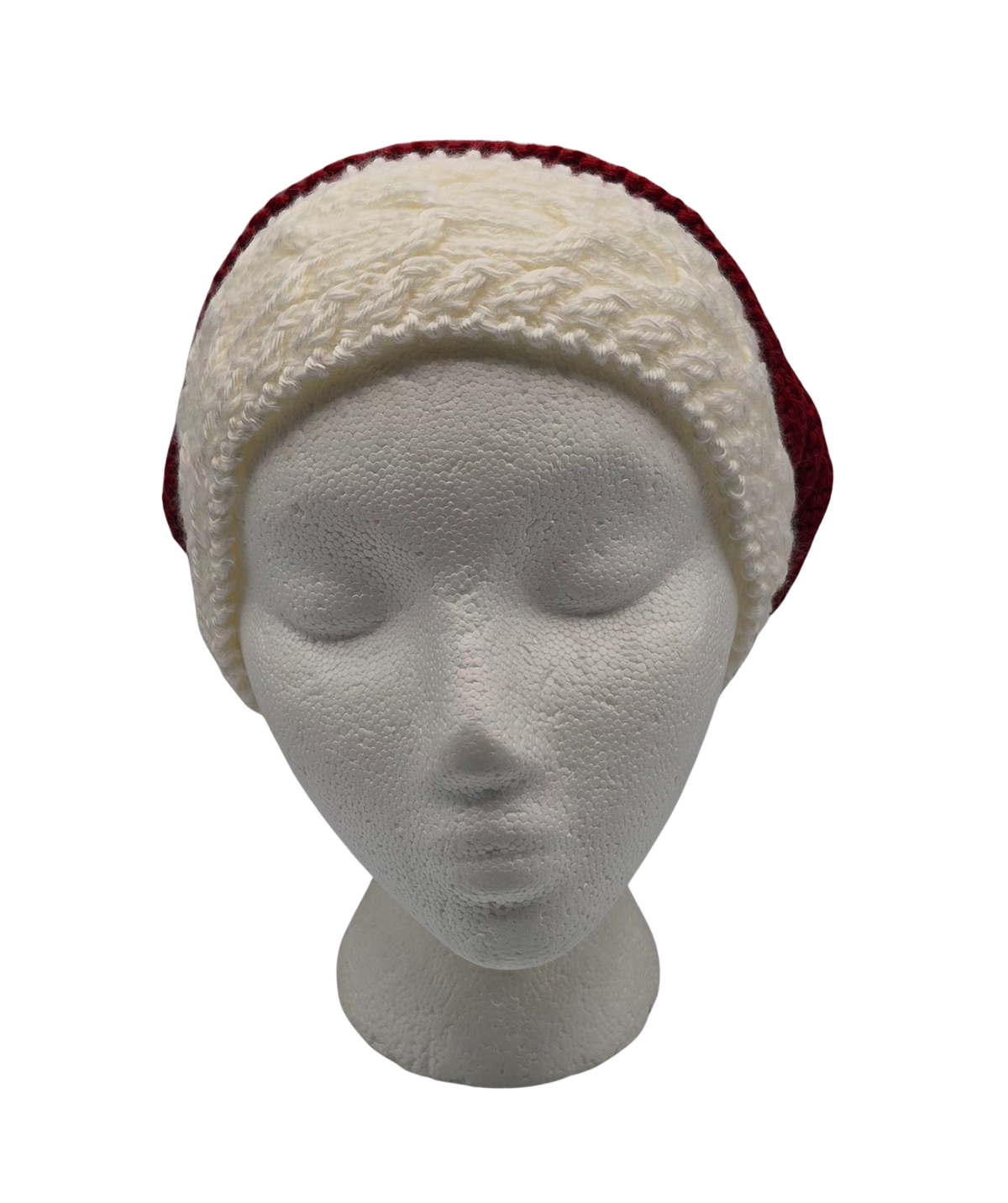 A red and white knit hat slouchy beanie with two pom-poms, displayed on a white mannequin head.